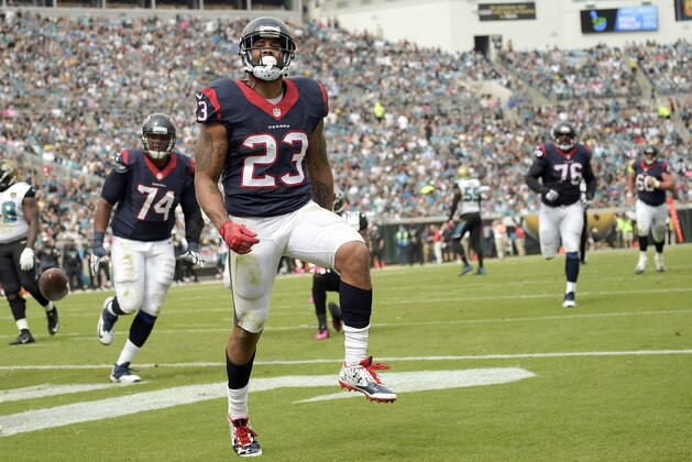 Houston Texans running back Arian Foster (23) celebrates his touchdown against the Jacksonville Jaguars during the first half of an NFL football game in Jacksonville, Fla., Sunday, Oct. 18, 2015. (AP Photo/Phelan M. Ebenhack)