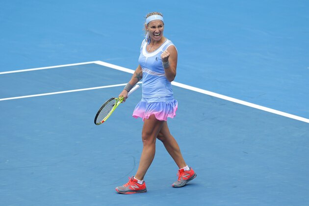SYDNEY, AUSTRALIA - JANUARY 15:  Svetlana Kuznetsova of Russia celebrates winning match point in her semi final match against Simona Halep of Romania during day six of the 2016 Sydney International at Sydney Olympic Park Tennis Centre on January 15, 2016 in Sydney, Australia.  (Photo by Mark Metcalfe/Getty Images)