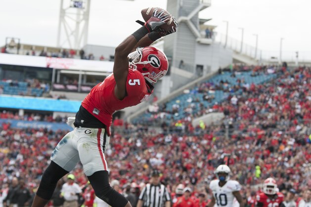 George wide receiver Terry Godwin catches a pass in the endzone for touchdown in the first half of the TaxSlayer Bowl NCAA college football game against Penn State in Jacksonville, Fla., Saturday, Jan. 2, 2016.  Georgia defeated Penn State 24-17.  (AP Photo/Mark Wallheiser)