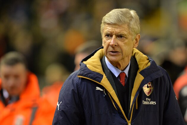 Arsenal's French manager Arsene Wenger looks on before the English Premier League football match between Liverpool and Arsenal at Anfield stadium in Liverpool, north-west England on January 13, 2016.
AFP PHOTO / PAUL ELLIS
RESTRICTED TO EDITORIAL USE. NO USE WITH UNAUTHORIZED AUDIO, VIDEO, DATA, FIXTURE LISTS, CLUB/LEAGUE LOGOS OR 'LIVE' SERVICES. ONLINE IN-MATCH USE LIMITED TO 75 IMAGES, NO VIDEO EMULATION. NO USE IN BETTING, GAMES OR SINGLE CLUB/LEAGUE/PLAYER PUBLICATIONS. / AFP / PAUL ELLIS        (Photo credit should read PAUL ELLIS/AFP/Getty Images)