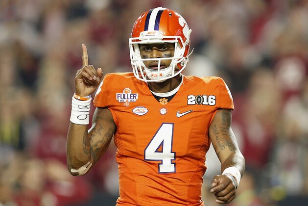 GLENDALE, AZ - JANUARY 11:  Deshaun Watson #4 of the Clemson Tigers celebrates after throwing an 11 yard touchdown pass to Hunter Renfrow #13 in the first quarter against the Alabama Crimson Tide during the 2016 College Football Playoff National Championship Game at University of Phoenix Stadium on January 11, 2016 in Glendale, Arizona.  (Photo by Christian Petersen/Getty Images)