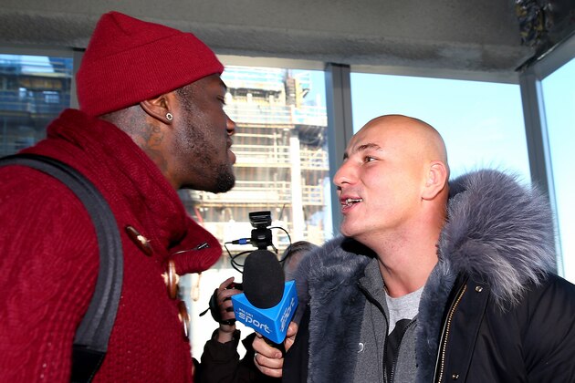 NEW YORK, NY - JANUARY 13:  Deontay Wilder and Artur Szpilka exchange words during a portrait and media availability on the terrace at Four World Trade Center on January 13, 2016 in New York City.  (Photo by Elsa/Getty Images)