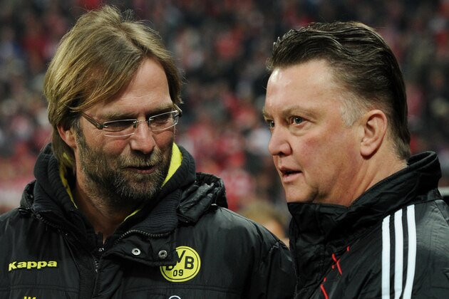 RESTRICTIONS / EMBARGO - ONLINE CLIENTS MAY USE UP TO SIX IMAGES DURING EACH MATCH WITHOUT THE AUTHORISATION OF THE DFL. NO MOBILE USE DURING THE MATCH AND FOR A FURTHER TWO HOURS AFTERWARDS IS PERMITTED WITHOUT THE AUTHORISATION OF THE DFL.Bayern Munich's Dutch head coach Louis van Gaal (R) and Dortmund's Dortmund's head coach Juergen Klopp greet each other as they arrive for the German first division Bundesliga football match FC Bayern Munich vs Borussia Dortmund in the southern German city of Munich on February 26, 2011. AFP PHOTO / CHRISTOF STACHE FC Bayern Munich vs Borussia Dortmund in the southern German city of Munich on February 26, 2011. AFP PHOTO / CHRISTOF STACHE (Photo credit should read CHRISTOF STACHE/AFP/Getty Images)
