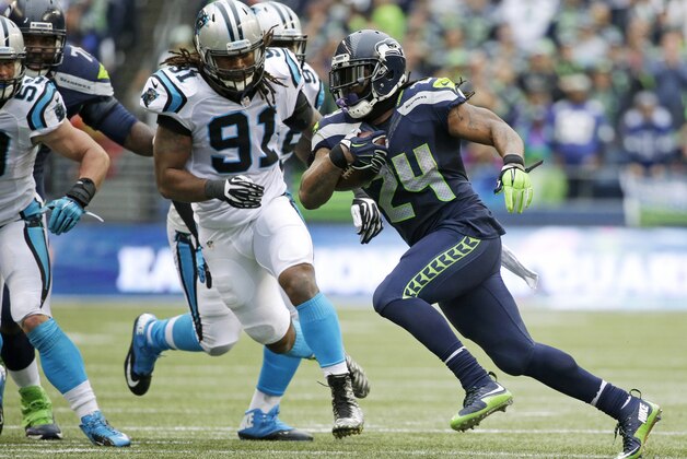 Seattle Seahawks running back Marshawn Lynch rushes against Carolina Panthers' Ryan Delaire (91) in the second half of an NFL football game, Sunday, Oct. 18, 2015, in Seattle. (AP Photo/Elaine Thompson) Seattle Seahawks running back Marshawn Lynch rushes against Carolina Panthers' Ryan Delaire (91) in the second half of an NFL football game, Sunday, Oct. 18, 2015, in Seattle. (AP Photo/Elaine Thompson)