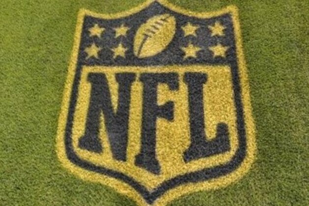 A general view of an NFL logo on the 50-yard line prior to an NFL football game between the Cleveland Browns and the Baltimore Ravens Monday, Nov. 30, 2015, in Cleveland. Baltimore won 33-27. (AP Photo/David Richard)