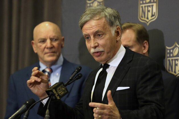 St. Louis Rams owner Stan Kroenke talks to the media after team owners voted Tuesday, Jan. 12, 2016, in Houston, to allow the Rams to move to a new stadium just outside Los Angeles, and the San Diego Chargers will have an option to share the facility. Houston Texans owner Bob McNair stands to his left. (AP Photo/Pat Sullivan)