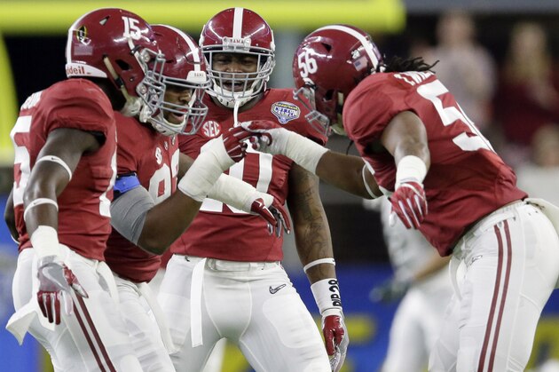 After sacking  Michigan State quarterback Connor Cook, Alabama defensive lineman Jonathan Allen (93) celebrates with teammates Ronnie Harrison (15), Reuben Foster (10) and Tim Williams (56) during the first half of the Cotton Bowl NCAA college football semifinal playoff game, Thursday, Dec. 31, 2015, in Arlington, Texas. (AP Photo/LM Otero)