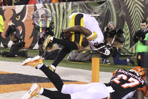 Pittsburgh Steelers' Martavis Bryant (10) makes a 10-yard touchdown reception against Cincinnati Bengals' Dre Kirkpatrick (27) during the second half of an NFL wild-card playoff football game Saturday, Jan. 9, 2016, in Cincinnati. (AP Photo/Gary Landers)