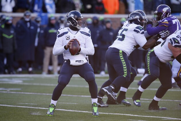 Seattle Seahawks quarterback Russell Wilson (3) passes against the Minnesota Vikings during the second half of an NFL wild-card football game, Sunday, Jan. 10, 2016, in Minneapolis. (AP Photo/Jim Mone)