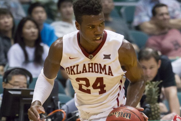 Oklahoma guard Buddy Hield (24) dribbles the basketball up court in the first half of an NCAA college basketball game against Harvard at the Diamond Head Classic, Friday, Dec. 25, 2015, in Honolulu. (AP Photo/Eugene Tanner)