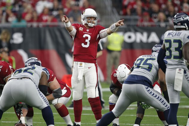Arizona Cardinals quarterback Carson Palmer (3) calls a play against the Seattle Seahawks during the first half of an NFL football game, Sunday, Jan. 3, 2016, in Glendale, Ariz. (AP Photo/Ross D. Franklin)
