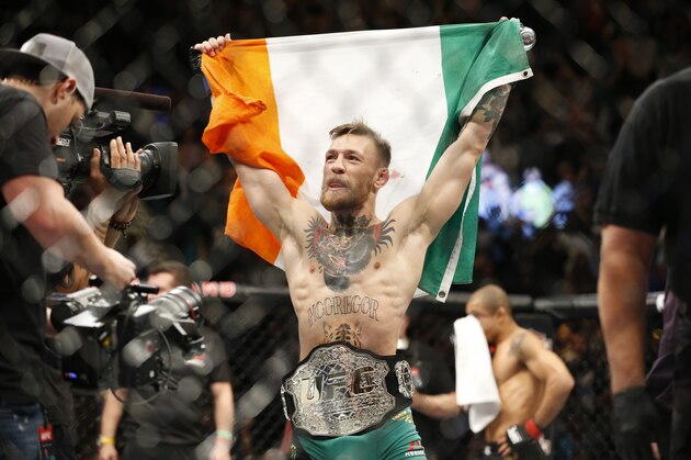 Conor McGregor reacts after defeating Jose Aldo during a featherweight  championship mixed martial arts bout at UFC 194, Saturday, Dec. 12, 2015, in Las Vegas. (AP Photo/John Locher)
