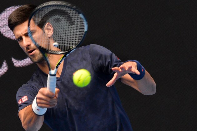 Novak Djokovic of Serbia hits a return during a practice session ahead of the Australian Open tennis tournament in Melbourne on January 15, 2016. AFP PHOTO / PAUL CROCK
--IMAGE RESTRICTED TO EDITORIAL USE - STRICTLY NO COMMERCIAL USE-- / AFP / PAUL CROCK        (Photo credit should read PAUL CROCK/AFP/Getty Images)