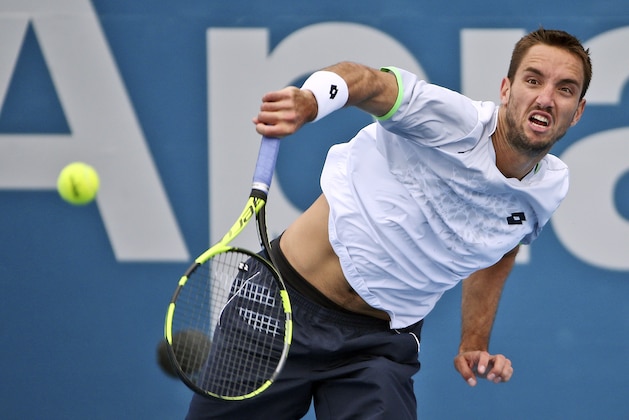 Viktor Troicki of Serbia serves in his quarterfinal match against Nicolas Mahut of France during the Sydney International Tennis tournament in Sydney Friday, Jan. 15, 2016.(AP Photo/Rob Griffith)