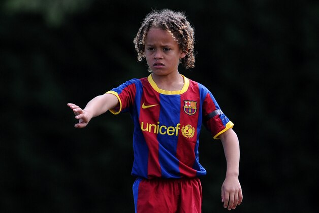 BARCELONA, SPAIN - MAY 15:  Eight-year-old Barcelona youth player Xavi Simons instructs his teammates during his match againts Llongueras on one of the pitches at the Joan Camper training ground on May 15, 2011 in Barcelona, Spain. Every weekend various teams of Barcelona youth players play in matches with the hope of one day making it to the top.  (Photo by Jasper Juinen/Getty Images)