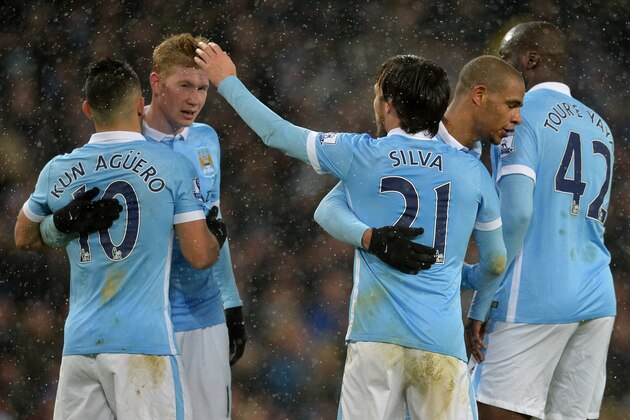 Manchester City's Spanish midfielder David Silva (3R) celebrates with teammates Manchester City's Argentinian striker Sergio Aguero, Manchester City's Belgian midfielder Kevin De Bruyne and Manchester City's Ivorian midfielder and captain Yaya Toure during the English Premier League football match between Manchester City and Crystal Palace at the Etihad Stadium in Manchester, north west England, on January 16, 2016. AFP PHOTO / PAUL ELLIS

RESTRICTED TO EDITORIAL USE. No use with unauthorized audio, video, data, fixture lists, club/league logos or 'live' services. Online in-match use limited to 75 images, no video emulation. No use in betting, games or single club/league/player publications. / AFP / PAUL ELLIS        (Photo credit should read PAUL ELLIS/AFP/Getty Images)