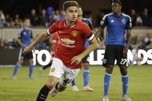 Manchester United midfielder Andreas Pereira, left, reacts after scoring a goal as San Jose Earthquakes midfielder Fatai Alashe, right, watches during the second half of an International Champions Cup soccer match Tuesday, July 21, 2015, in San Jose, Calif. Manchester United won 3-1. (AP Photo/Eric Risberg)