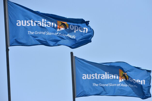 Flags with logos on display flutter in the wind ahead of the 2016 Australian Open tennis tournament in Melbourne on January 16, 2016. AFP PHOTO / PAUL CROCK- IMAGE RESTRICTED TO EDITORIAL USE - STRICTLY NO COMMERCIAL USE / AFP / PAUL CROCK        (Photo credit should read PAUL CROCK/AFP/Getty Images)