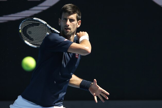 Serbia's Novak Djokovic plays a shot during a practice session, ahead of the Australian Open tennis championships in Melbourne, Australia, Saturday, Jan. 16, 2016.(AP Photo/Vincent Thian)