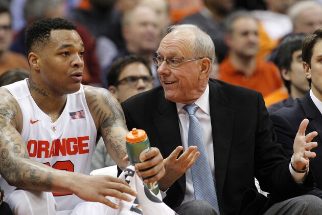 Syracuse head coach Jim Boeheim, right, talks with Dajuan Coleman, left, on the bench in the first half of an NCAA college basketball game against Boston College in Syracuse, N.Y., Wednesday, Jan. 13, 2016. (AP Photo/Nick Lisi)
