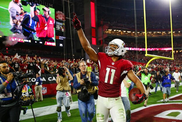 Jan 16, 2016; Glendale, AZ, USA; Arizona Cardinals wide receiver Larry Fitzgerald (11) celebrates after scoring the winning touchdown against the Green Bay Packers during overtime in a NFC Divisional round playoff game at University of Phoenix Stadium. Mandatory Credit: Mark J. Rebilas-USA TODAY Sports