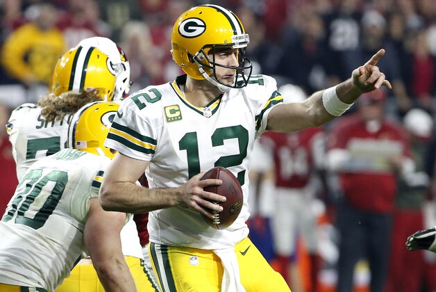 Green Bay Packers quarterback Aaron Rodgers (12) points to a receiver during the second half of an NFL divisional playoff football game against the Arizona Cardinals, Saturday, Jan. 16, 2016, in Glendale, Ariz. (AP Photo/Ross D. Franklin)