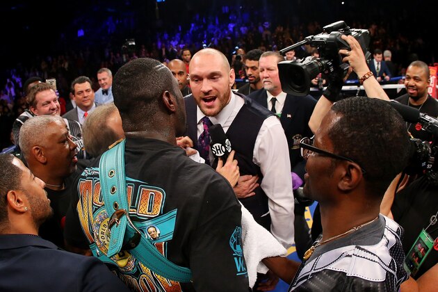 NEW YORK, NY - JANUARY 16:  Deontay Wilder and Heavyweight Champion Tyson Fury exchange words after defeating Artur Szpilka at Barclays Center on January 16, 2016 in Brooklyn borough of New York City.  (Photo by Mike Stobe/Getty Images)