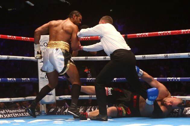 LONDON, ENGLAND - JANUARY 16: David Haye (L) of England is pushed away by the referee after knocking out Mark De Mori of Australia during their International heavyweight contest at The O2 Arena on January 16, 2016 in London, England. (Photo by Charlie Crowhurst/Getty Images)