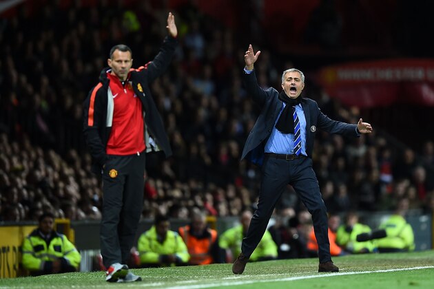 MANCHESTER, ENGLAND - OCTOBER 26:  Chelsea Manager Jose Mourinho (R) protests  during the Barclays Premier League match between Manchester United and Chelsea at Old Trafford on October 26, 2014 in Manchester, England.  (Photo by Laurence Griffiths/Getty Images)