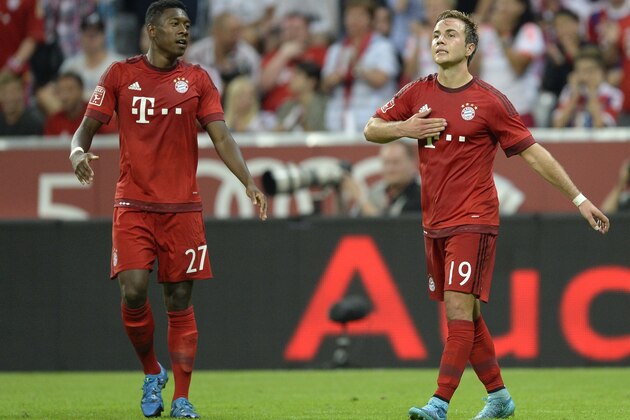 Bayern Munich's Austrian defender David Alaba (L) and Bayern Munich's midfielder Mario Goetze (R) celebrate after Goetze scored during the Audi Cup football match FC Bayern Munich vs AC Milan in Munich, southern Germany, on August 4, 2015. The Audi Cup football matches with Bayern Munich of Germany, Real Madrid of Spain, AC Milan of Italy and Tottenham Hotspur of England will take place in Munich on August 4 and August 5, 2015. AFP PHOTO / CHRISTOF STACHE        (Photo credit should read CHRISTOF STACHE/AFP/Getty Images)