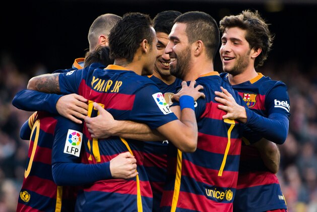 BARCELONA, SPAIN - JANUARY 09: (L-R) Neymar Santos Jr, Luis Suarez, Arda Turan and Sergi Roberto of FC Barcelona celebrate after their teammate Lionel Messi scored his team's third goal during the La Liga match between FC Barcelona and Granada CF at Camp Nou on January 9, 2016 in Barcelona, Spain. (Photo by Alex Caparros/Getty Images)