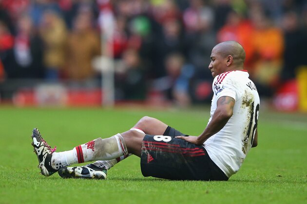 LIVERPOOL, ENGLAND - JANUARY 17:  Ashley Young of Manchester United reacts after a challenge by James Milner of Liverpool during the Barclays Premier League match between Liverpool and Manchester United at Anfield on January 17, 2016 in Liverpool, England.  (Photo by Alex Livesey/Getty Images)