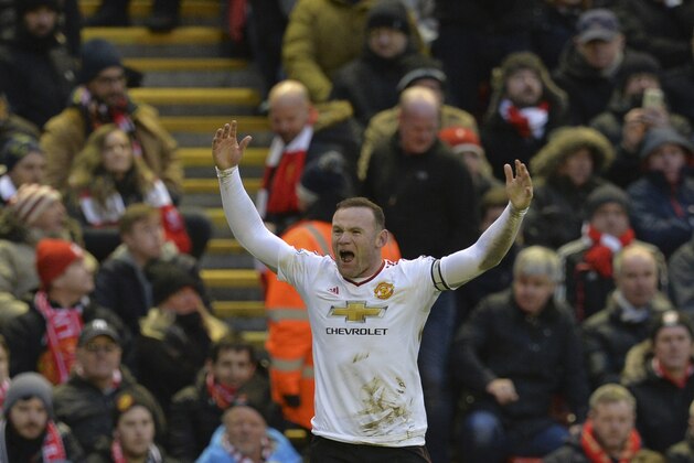 Manchester United's English striker Wayne Rooney celebrates scoring the opening goal during the English Premier League football match between Liverpool and Manchester United at Anfield in Liverpool, northwest England, on January 17, 2016.  AFP PHOTO / PAUL ELLIS

RESTRICTED TO EDITORIAL USE. No use with unauthorized audio, video, data, fixture lists, club/league logos or 'live' services. Online in-match use limited to 75 images, no video emulation. No use in betting, games or single club/league/player publications. / AFP / PAUL ELLIS        (Photo credit should read PAUL ELLIS/AFP/Getty Images)