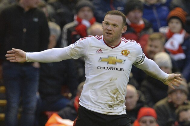 Manchester United's English striker Wayne Rooney celebrates scoring the opening goal during the English Premier League football match between Liverpool and Manchester United at Anfield in Liverpool, northwest England, on January 17, 2016.  AFP PHOTO / PAUL ELLIS

RESTRICTED TO EDITORIAL USE. No use with unauthorized audio, video, data, fixture lists, club/league logos or 'live' services. Online in-match use limited to 75 images, no video emulation. No use in betting, games or single club/league/player publications. / AFP / PAUL ELLIS        (Photo credit should read PAUL ELLIS/AFP/Getty Images)