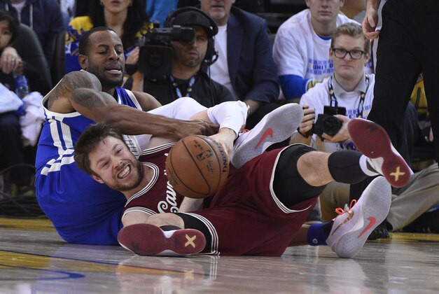 December 25, 2015; Oakland, CA, USA; Cleveland Cavaliers guard Matthew Dellavedova (8, bottom) and Golden State Warriors forward Andre Iguodala (9, top) fight for the ball in the second quarter of a NBA basketball game on Christmas at Oracle Arena. Mandatory Credit: Kyle Terada-USA TODAY Sports