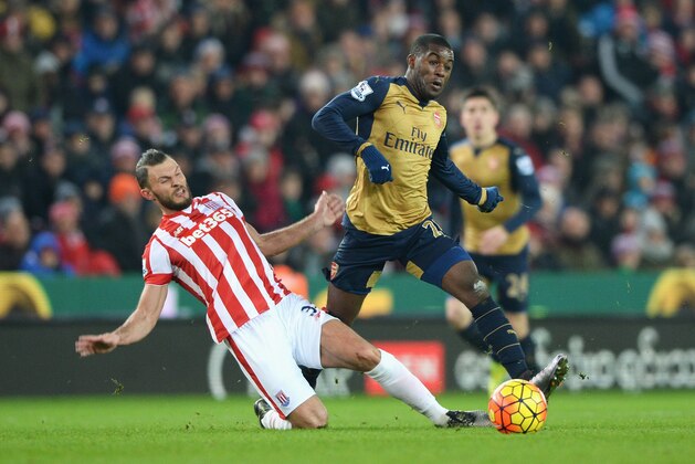 STOKE ON TRENT, ENGLAND - JANUARY 17:  Erik Pieters of Stoke City tackles Joel Campbell of Arsenal during the Barclays Premier League match between Stoke City and Arsenal at Britannia Stadium on January 17, 2016 in Stoke on Trent, England.  (Photo by Gareth Copley/Getty Images)