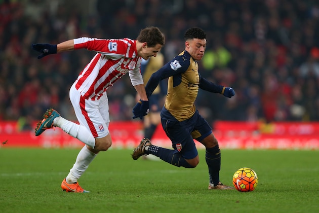 STOKE-ON-TRENT, ENGLAND - JANUARY 17:  Philipp Wollscheid of Stoke City and Alex Oxlade-Chamberlain of Arsenal during the Barclays Premier League match between Stoke City and Arsenal at the Britannia Stadium on January 17, 2016 in Stoke-on-Trent, England.  (Photo by Catherine Ivill - AMA/Getty Images)