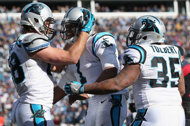 CHARLOTTE, NC - JANUARY 17:   Cam Newton #1,  Greg Olsen #88, and  Mike Tolbert #35 of the Carolina Panthers celebrate after a touchdown against the Seattle Seahawks in the 2nd quarter during the NFC Divisional Playoff Game at Bank of America Stadium on January 17, 2016 in Charlotte, North Carolina.  (Photo by Streeter Lecka/Getty Images)