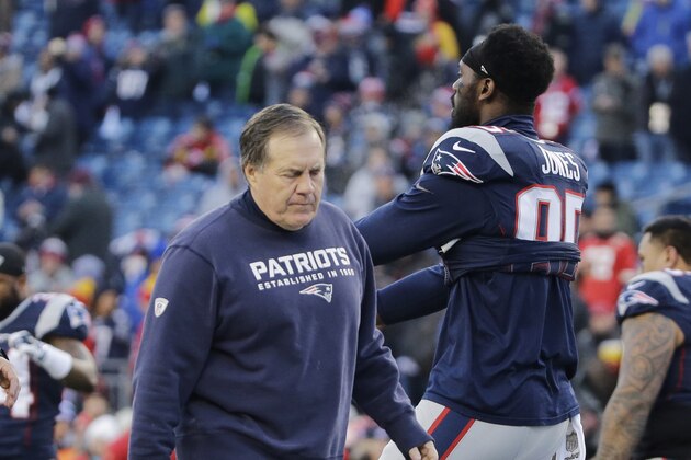 New England Patriots head coach Bill Belichick walks past New England Patriots defensive end Chandler Jones (95) as the team warms up before an NFL divisional playoff football game against the Kansas City Chiefs, Saturday, Jan. 16, 2016, in Foxborough, Mass. (AP Photo/Elise Amendola)