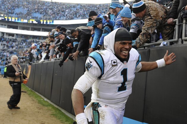 Carolina Panthers quarterback Cam Newton (1) celebrates with fans after the second half of an NFL divisional playoff football game against the Seattle Seahawks, Sunday, Jan. 17, 2016, in Charlotte, N.C. The Panthers won 31-24. (AP Photo/Mike McCarn)