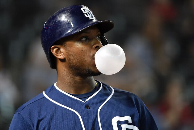 PHOENIX, AZ - SEPTEMBER 14:  Justin Upton #10 of the San Diego Padres blows a bubble while in the on deck circle in the fifth inning during a game against the Arizona Diamondbacks at Chase Field on September 14, 2015 in Phoenix, Arizona.  (Photo by Norm Hall/Getty Images)