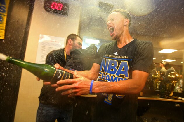 CLEVELAND, OH - JUNE 16:  Stephen Curry #30 of the Golden State Warriors reacts in the locker room  after the Golden State Warriors win Game Six of the 2015 NBA Finals against the Cleveland Cavaliers at The Quicken Loans Arena on June 16, 2015 in Cleveland, Ohio. NOTE TO USER: User expressly acknowledges and agrees that, by downloading and/or using this Photograph, user is consenting to the terms and conditions of the Getty Images License Agreement. Mandatory Copyright Notice: Copyright 2015 NBAE (Photo by Nathaniel S. Butler/NBAE via Getty Images)