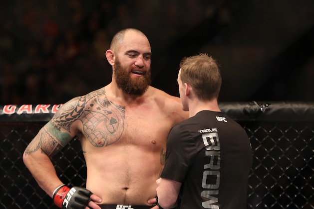 Travis Browne celebrates with a cornerman after a win against Matt Mitrione in their mixed martial arts bout at UFC Fight Night 81, Sunday, Jan. 2, 2016, in Boston. Browne won via third round TKO.  (AP Photo/Gregory Payan)