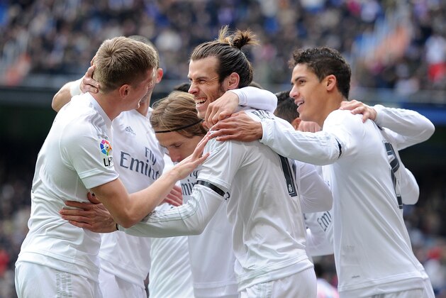 MADRID, SPAIN - JANUARY 17:  Gareth Bale of Real Madrid celebrates with team mates after scoring his team's opening goal during the La Liga match between Real Madrid CF and Sporting Gijon at Estadio Santiago Bernabeu on January 17, 2016 in Madrid, Spain.  (Photo by Denis Doyle/Getty Images)