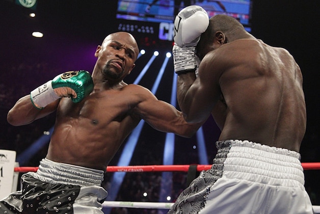Floyd Mayweather Jr. (L) lands on punch on Andre Berto during the fight for the WBO Welterweight World Title at the MGM Grand Garden Arena in Las Vegas, Nevada on September 12, 2015. Floyd Mayweather earned a unanimous decision over Andre Berto to claim his 49th and he says final victim in a glittering unbeaten ring career spanning two decades. AFP PHOTO/JOHN GURZINSKI (Photo credit should read JOHN GURZINSKI/AFP/Getty Images) Floyd Mayweather Jr. (L) lands on punch on Andre Berto during the fight for the WBO Welterweight World Title at the MGM Grand Garden Arena in Las Vegas, Nevada on September 12, 2015. Floyd Mayweather earned a unanimous decision over Andre Berto to claim his 49th and he says final victim in a glittering unbeaten ring career spanning two decades. AFP PHOTO/JOHN GURZINSKI (Photo credit should read JOHN GURZINSKI/AFP/Getty Images)