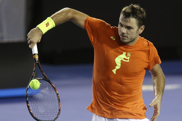 Switzerland's Stan Wawrinka makes a backhand return during a training session on Rod Laver Arena ahead of the Australian Open tennis championships in Melbourne, Australia, Thursday, Jan. 14, 2016.(AP Photo/Mark Baker)