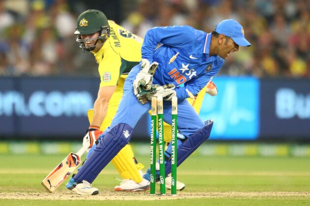 MELBOURNE, AUSTRALIA - JANUARY 17:  Mitchell Marsh of Australia is run out by MS Dhoni of India during game three of the One Day International Series between Australia and India at the Melbourne Cricket Ground on January 17, 2016 in Melbourne, Australia.  (Photo by Scott Barbour/Getty Images)