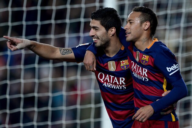 Barcelona's Uruguayan forward Luis Suarez (L) celebrates with Barcelona's Brazilian forward Neymar after scoring during the Spanish league football match FC Barcelona vs Athletic Club Bilbao at the Camp Nou stadium in Barcelona on January 17, 2016.   AFP PHOTO/ JOSEP LAGO / AFP / JOSEP LAGO        (Photo credit should read JOSEP LAGO/AFP/Getty Images)