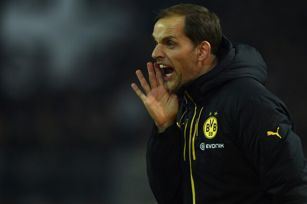 Dortmund's head coach Thomas Tuchel reacts during the German first division Bundesliga football match Borussia Dortmund vs Eintracht Frankfurt in Dortmund, western Germany, on December 13, 2015. Dortmund won the match 4 - 1. 
AFP PHOTO / PATRIK STOLLARZ

RESTRICTIONS: DURING MATCH TIME: DFL RULES TO LIMIT THE ONLINE USAGE TO 15 PICTURES PER MATCH AND FORBID IMAGE SEQUENCES TO SIMULATE VIDEO. == RESTRICTED TO EDITORIAL USE == FOR FURTHER QUERIES PLEASE CONTACT DFL DIRECTLY AT + 49 69 650050. / AFP / PATRIK STOLLARZ        (Photo credit should read PATRIK STOLLARZ/AFP/Getty Images)