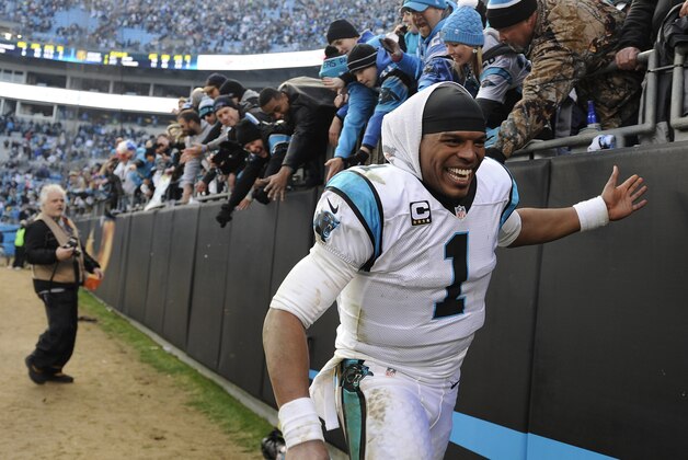 Carolina Panthers quarterback Cam Newton (1) celebrates with fans after the second half of an NFL divisional playoff football game against the Seattle Seahawks, Sunday, Jan. 17, 2016, in Charlotte, N.C. The Panthers won 31-24. (AP Photo/Mike McCarn)